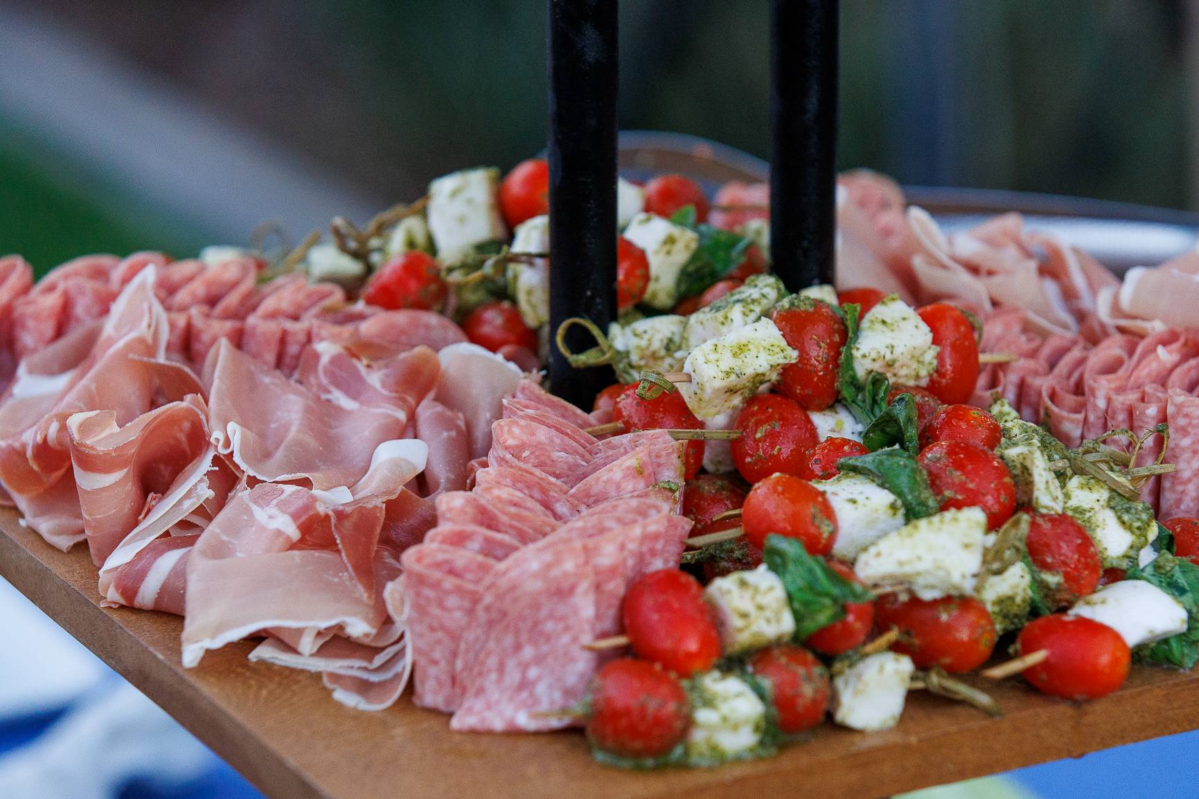 Charcuterie board with prosciutto and caprese skewers