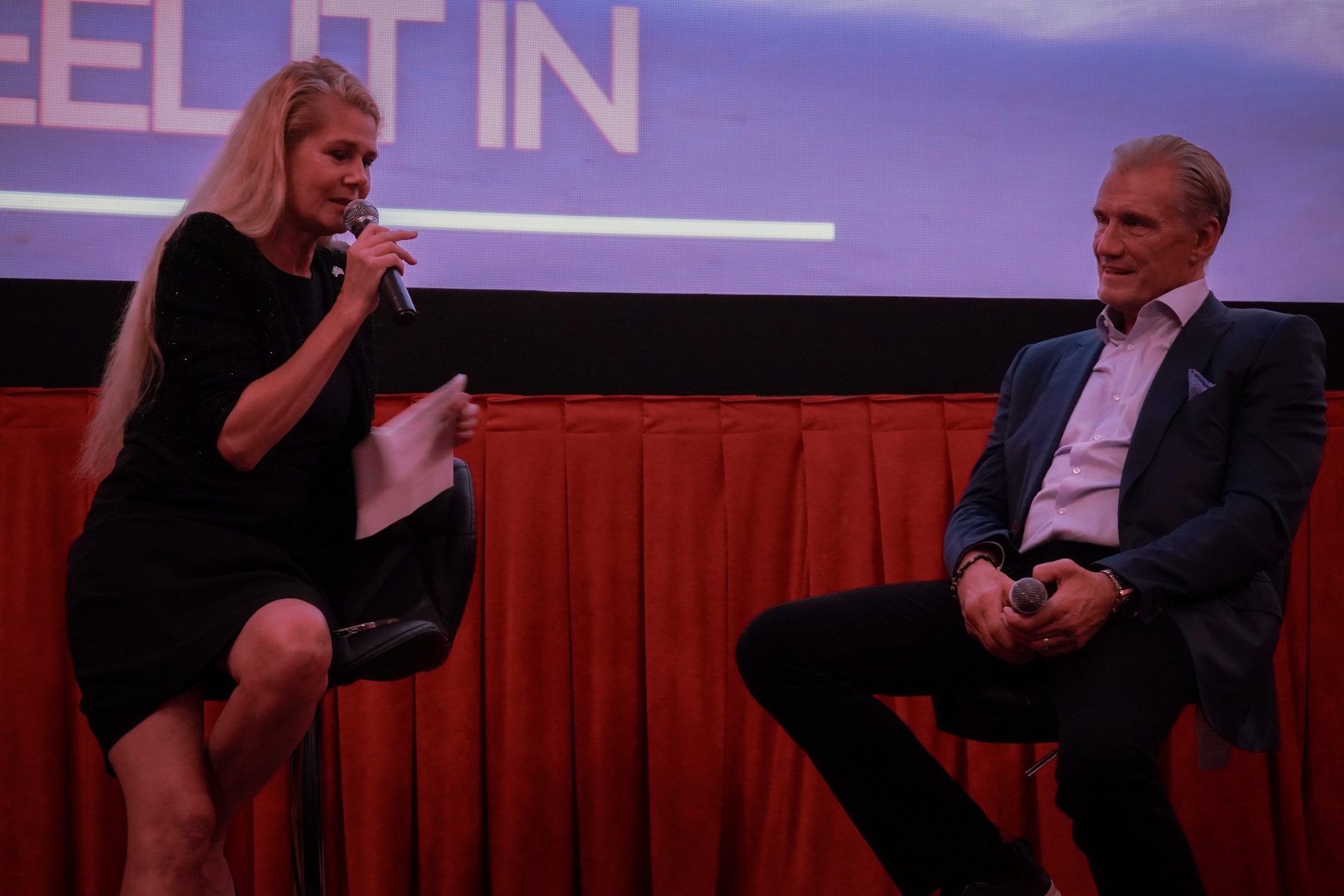 Moderator and guest speaker seated on stage for the Q&A