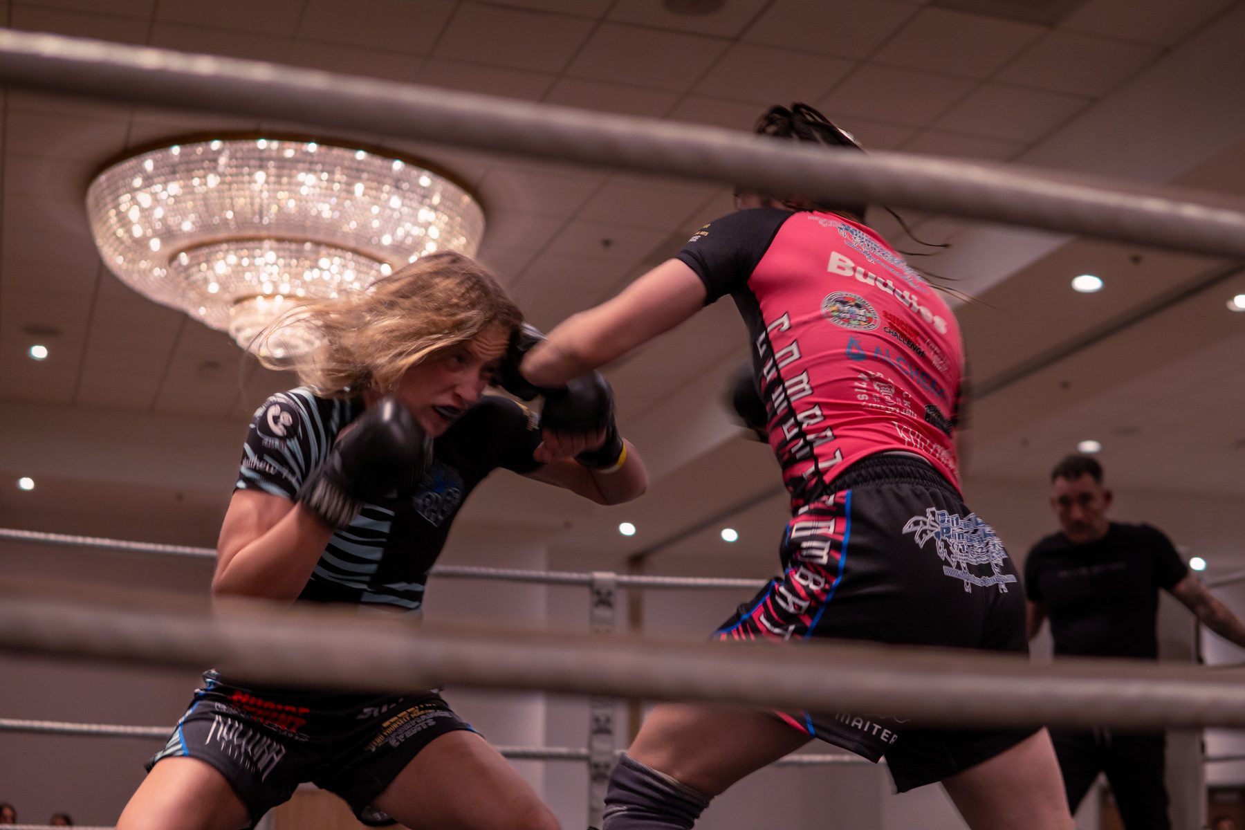 Two fighters trading strikes inside the ring