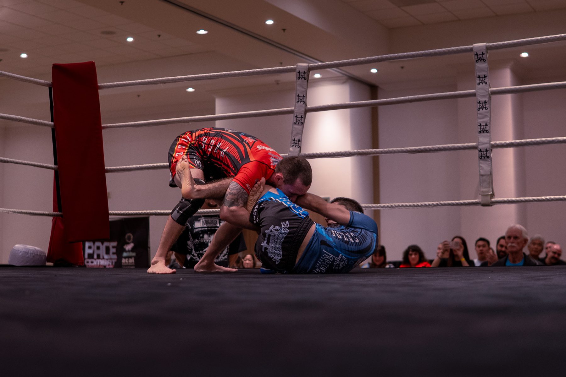 Two grapplers working for position on the mat